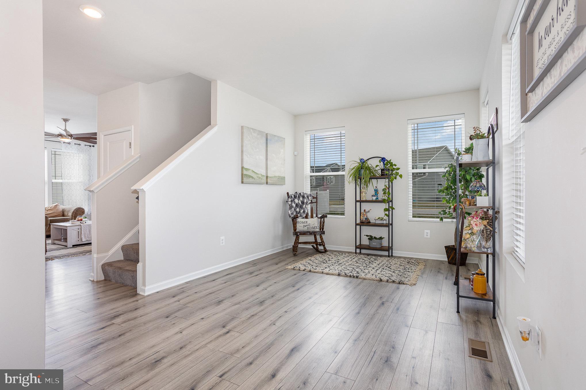 10 Beech Ridge Lane York, PA 17404 - Photo 6 of 47 a view of a livingroom with wooden floor and stairs