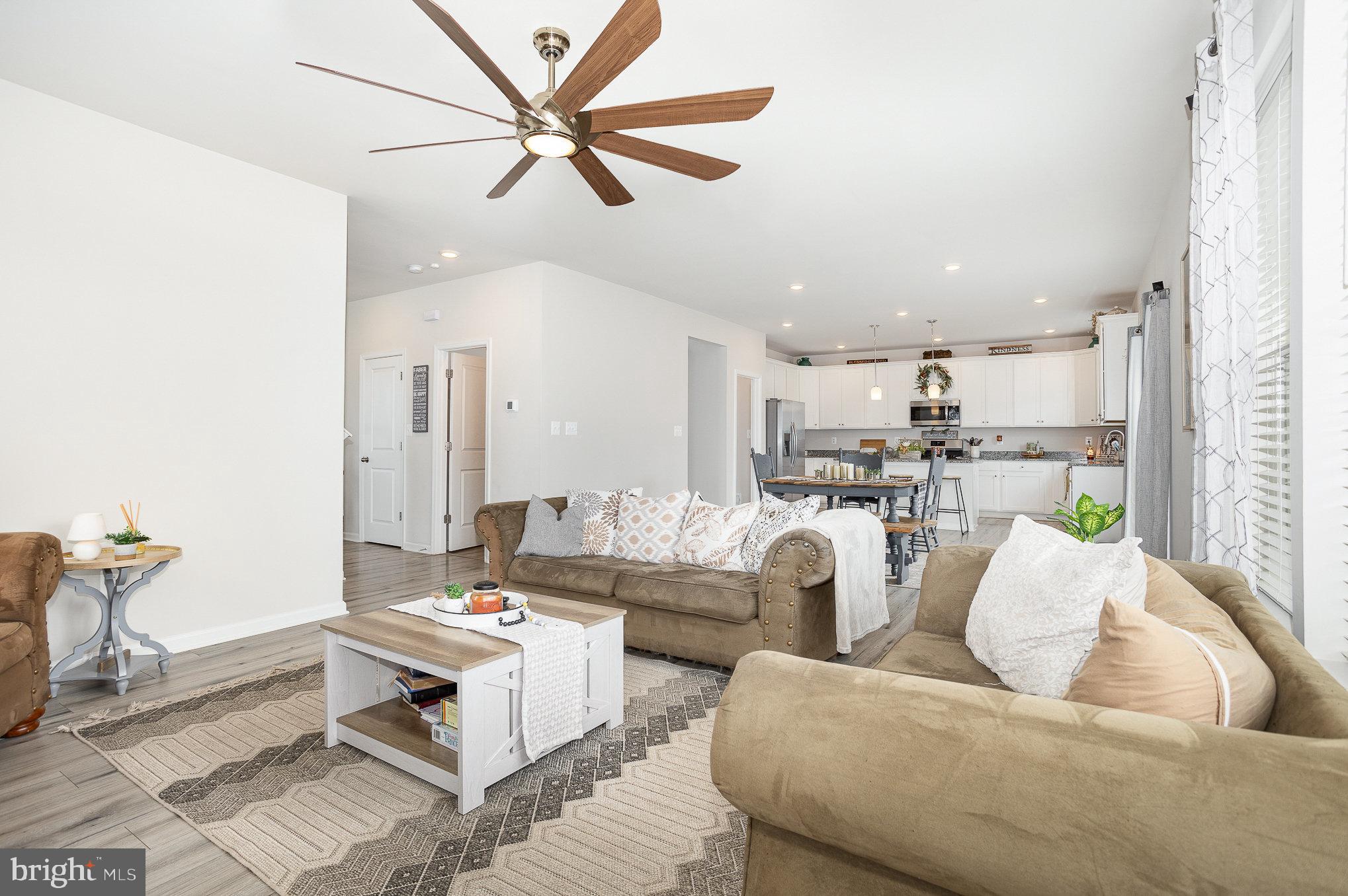 10 Beech Ridge Lane York, PA 17404 - Photo 10 of 47 a living room with furniture kitchen view and a chandelier