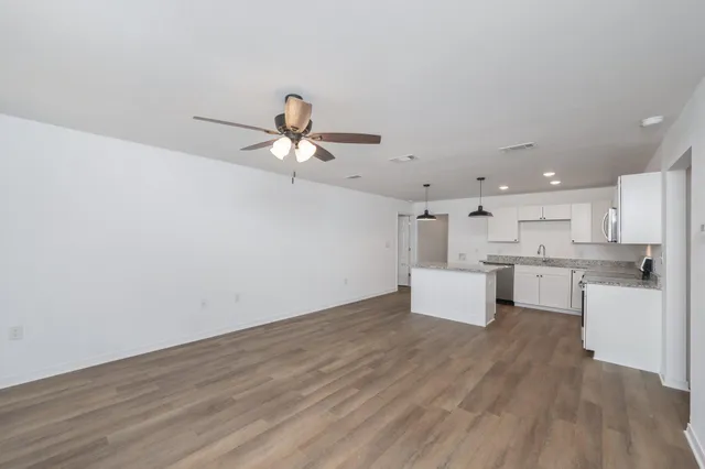 a view of kitchen with wooden floor and window