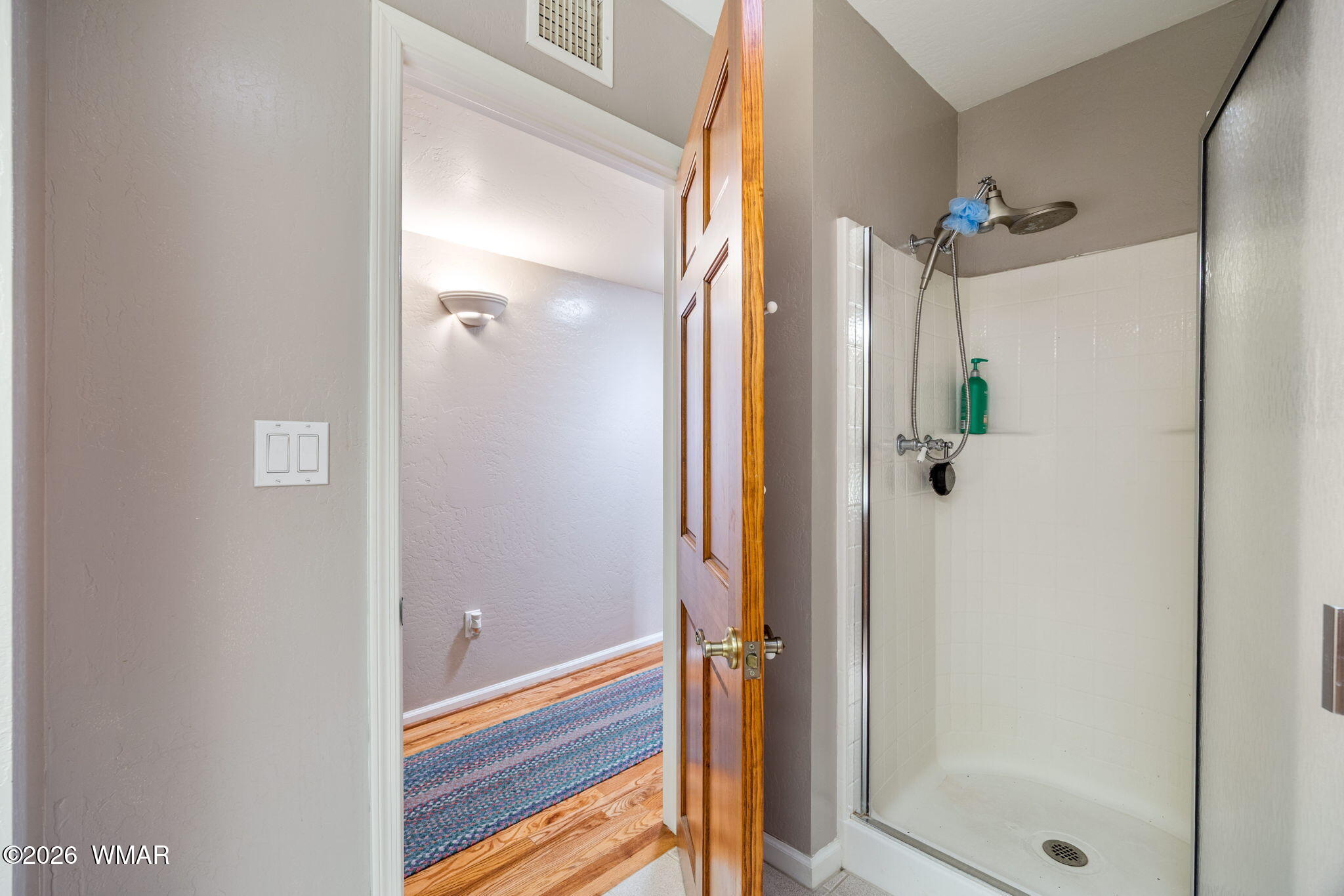 2922 Pine Rim Road Overgaard, AZ 85933 - Photo 27 of 58 a bathroom with a shower and a glass door