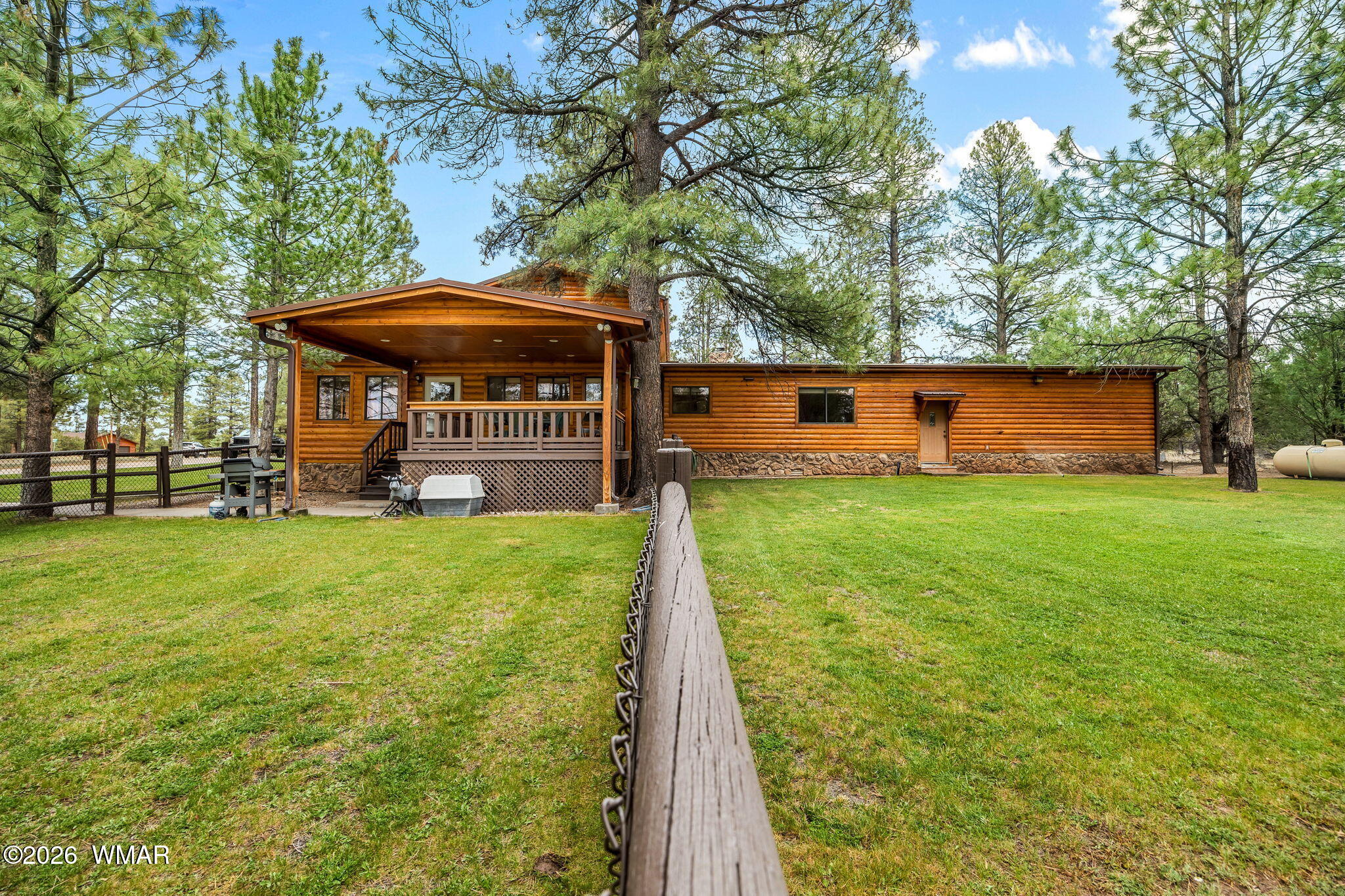 2922 Pine Rim Road Overgaard, AZ 85933 - Photo 42 of 58 a view of a house with backyard and a tree
