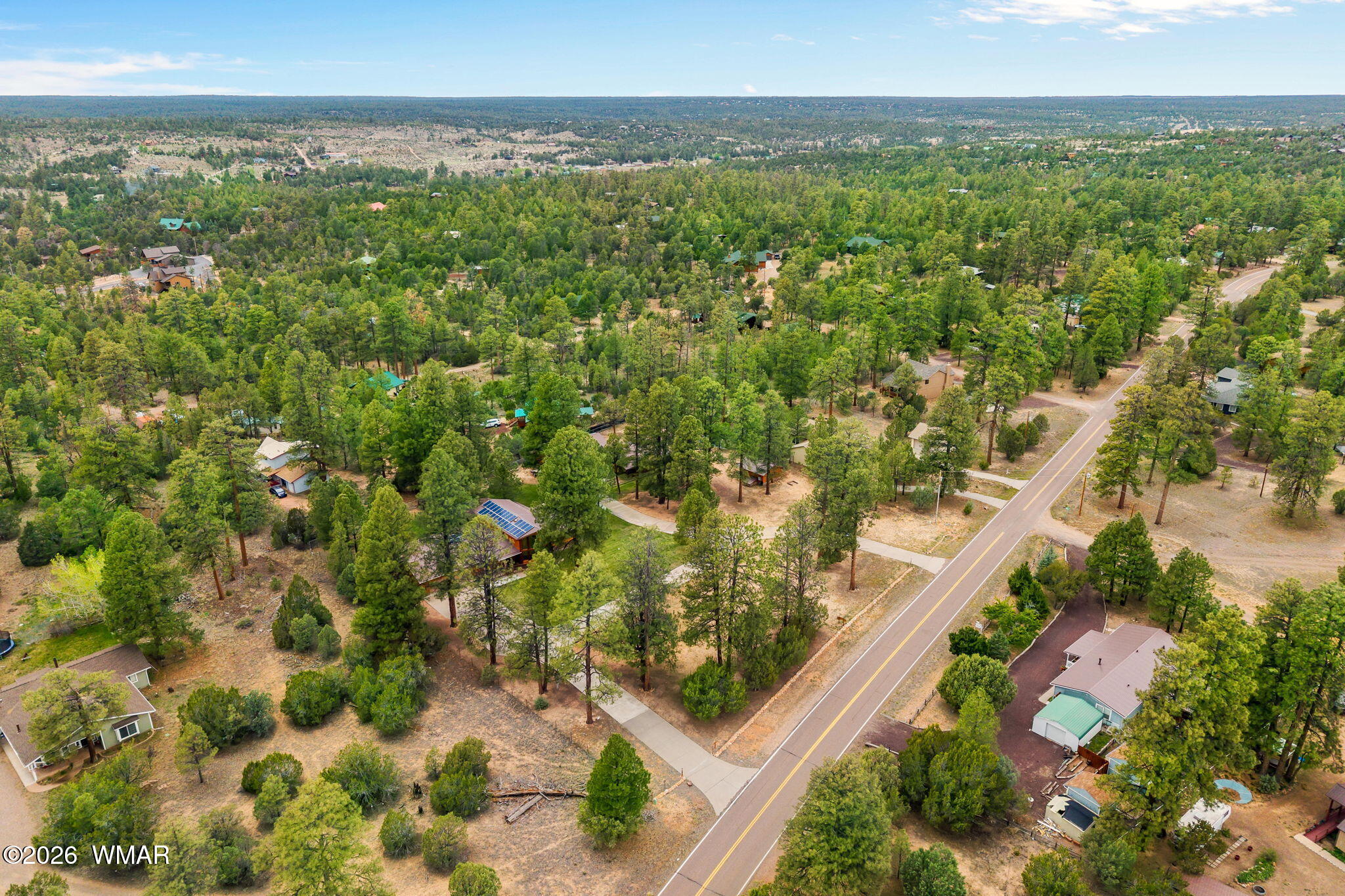2922 Pine Rim Road Overgaard, AZ 85933 - Photo 51 of 58 a view of a city with lush green forest