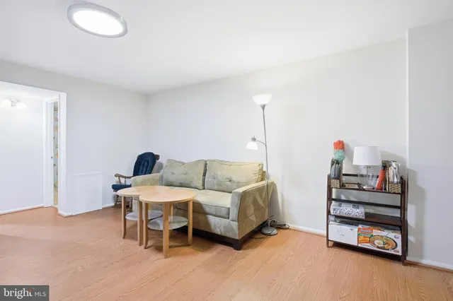 a bedroom with furniture and a wooden floor