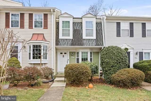 a view of a brick building next to a yard