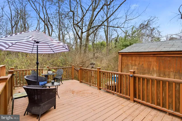 a view of balcony with wooden floor and outdoor seating