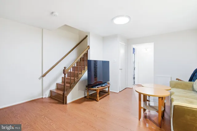 a view of a room with stairs and furniture