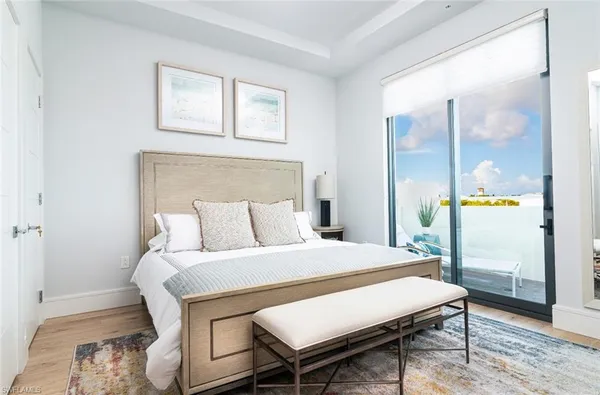 a bedroom with a bed and a mirror