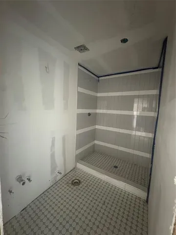 a view of a room with windows and tub