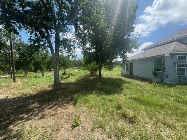 a view of a lake with a yard