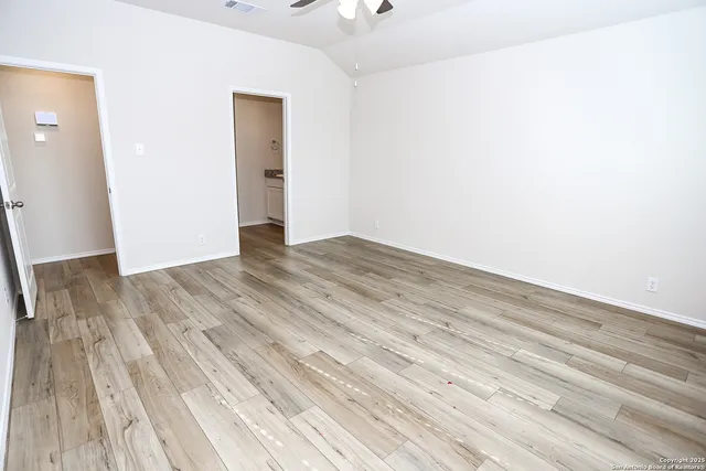 wooden floor in a white room