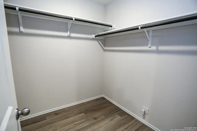 a view of a room with shelf on the wall