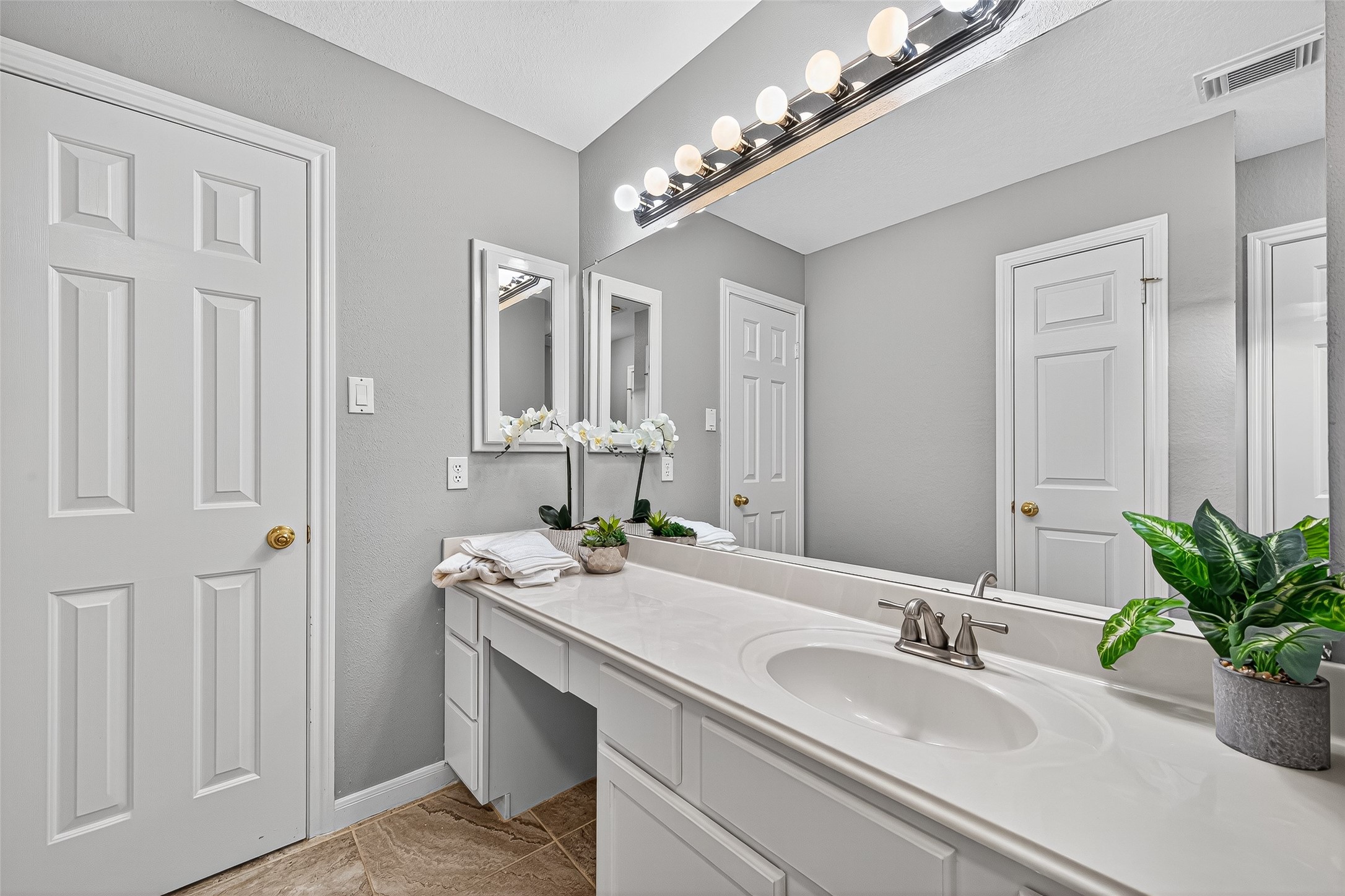 13011 Mossy Ridge Cove Houston, TX 77041 - Photo 38 of 50 This bathroom features a sleek design with a large vanity, ample counter space, and stylish lighting.