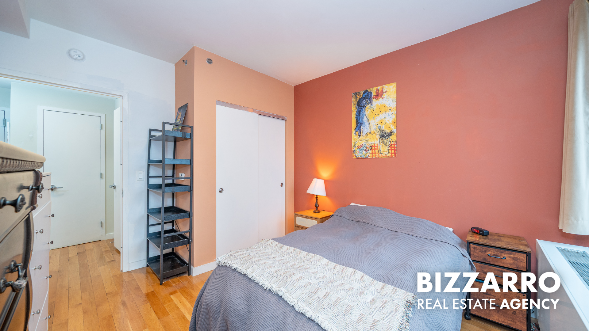 Tilden Street, Unit 6F Bronx, NY 10467 - Photo 9 of 29 a bedroom with a bed and a book shelf