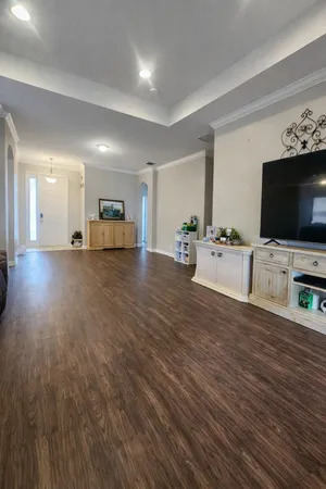 a view of a livingroom with furniture and flat screen tv