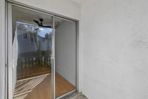 a bathroom with a glass shower door