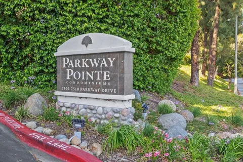 a view of sign board with green space