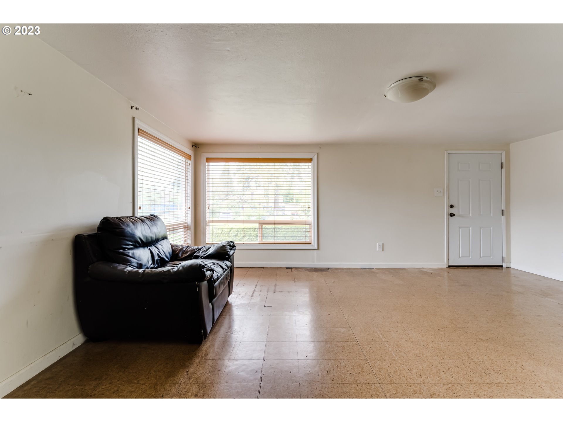 1163 D Street Springfield, OR 97477 - Photo 16 of 37 a living room with furniture and a window