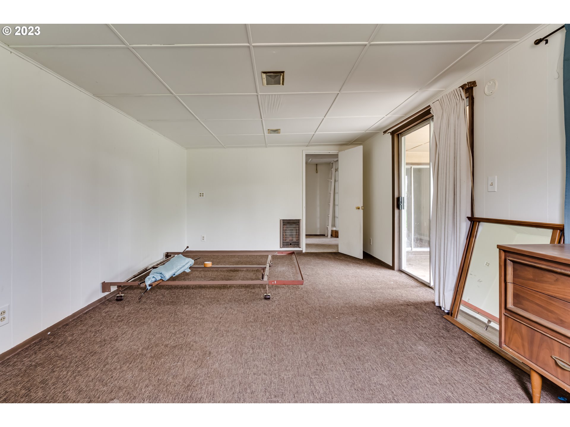 1163 D Street Springfield, OR 97477 - Photo 23 of 37 a living room with a furniture and a ceiling fan