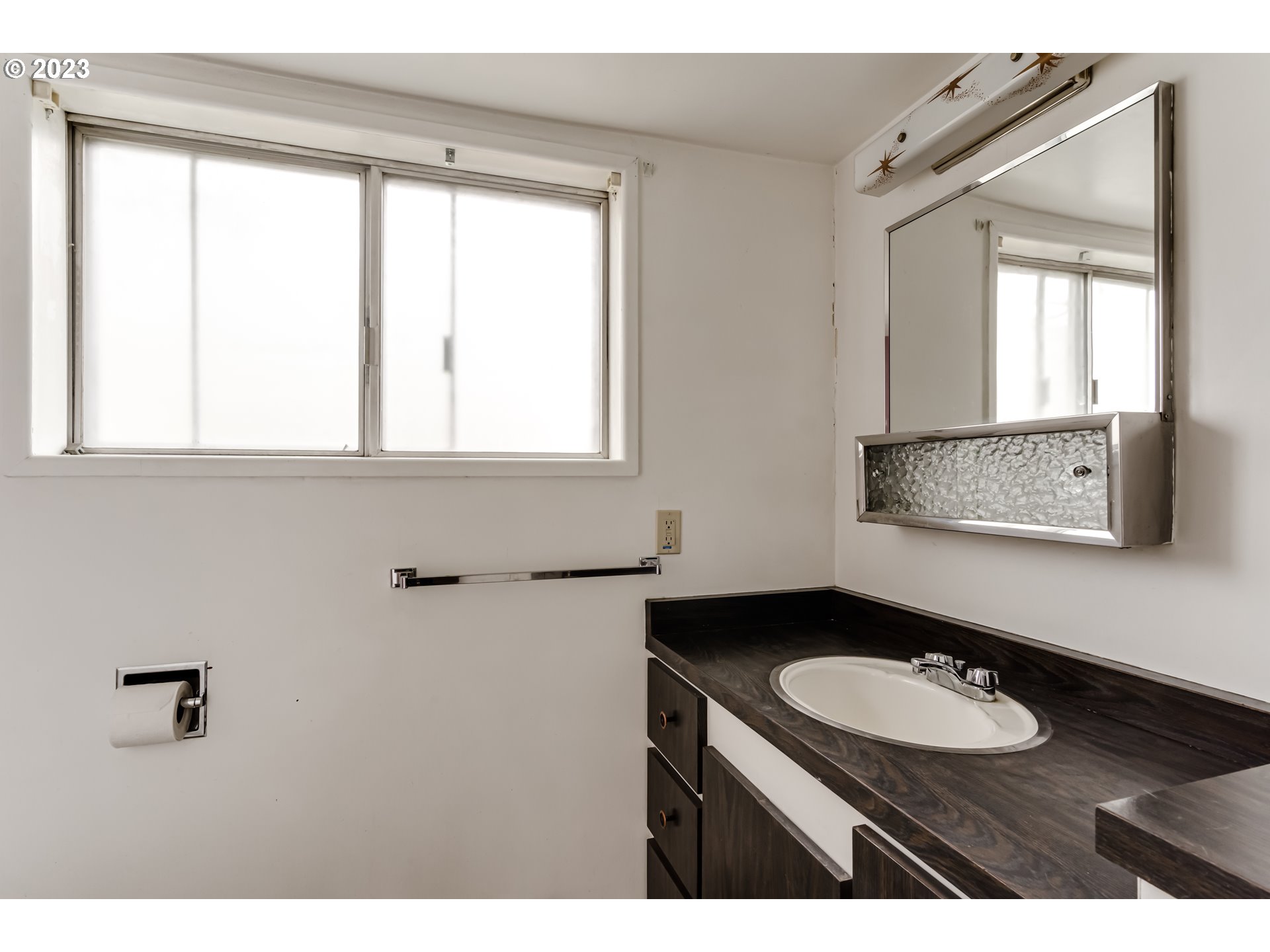 1163 D Street Springfield, OR 97477 - Photo 26 of 37 a bathroom with a sink and a mirror