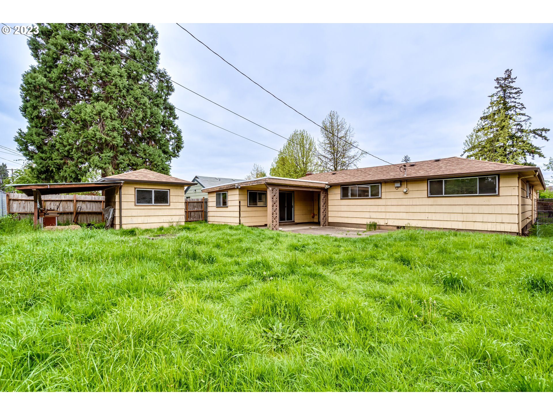 1163 D Street Springfield, OR 97477 - Photo 32 of 37 a aerial view of a house with a yard table and chairs