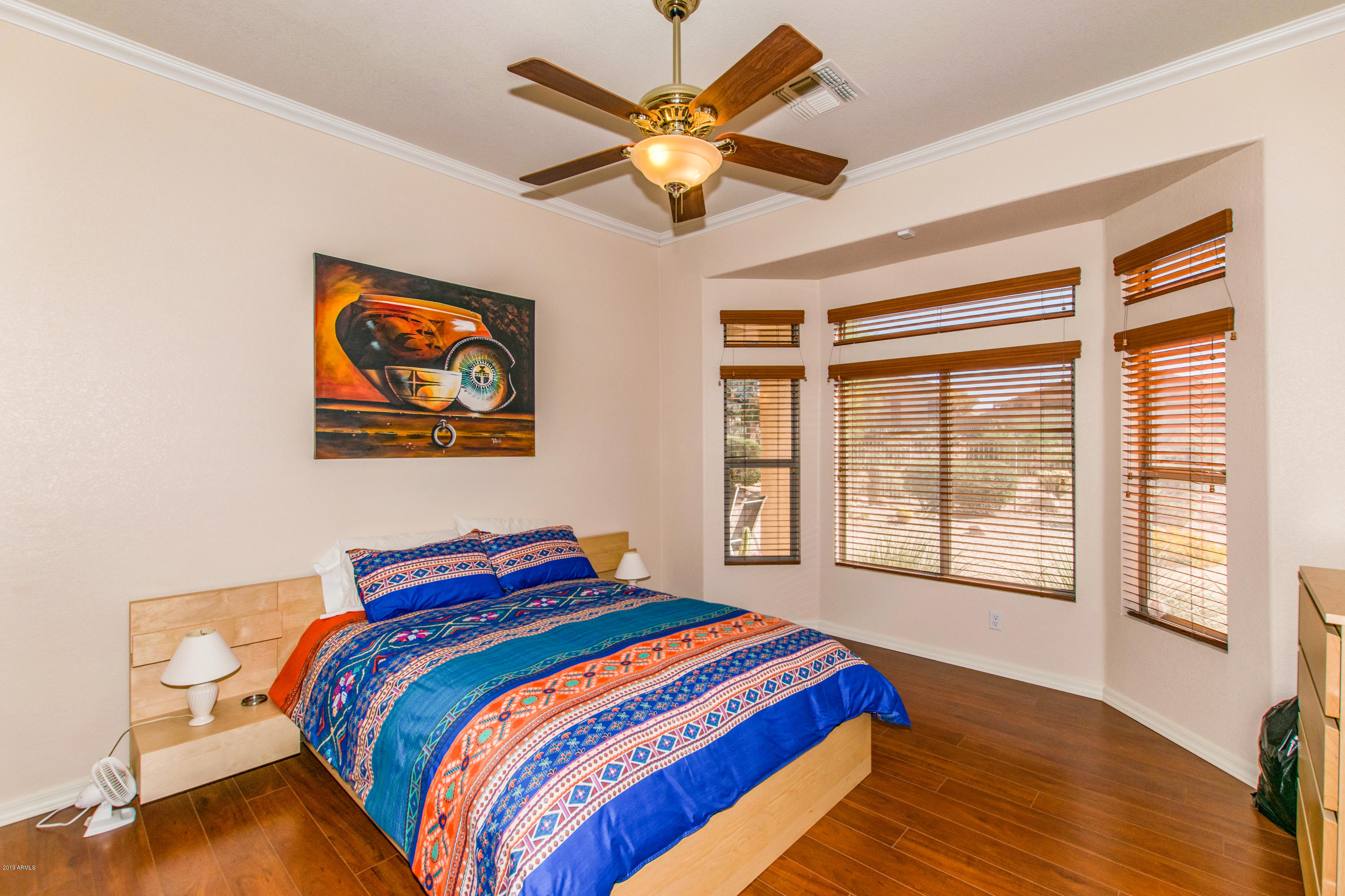 4291 South Strong Box Road Gold Canyon, AZ 85118 - Photo 12 of 27 a bedroom with bed and a large window