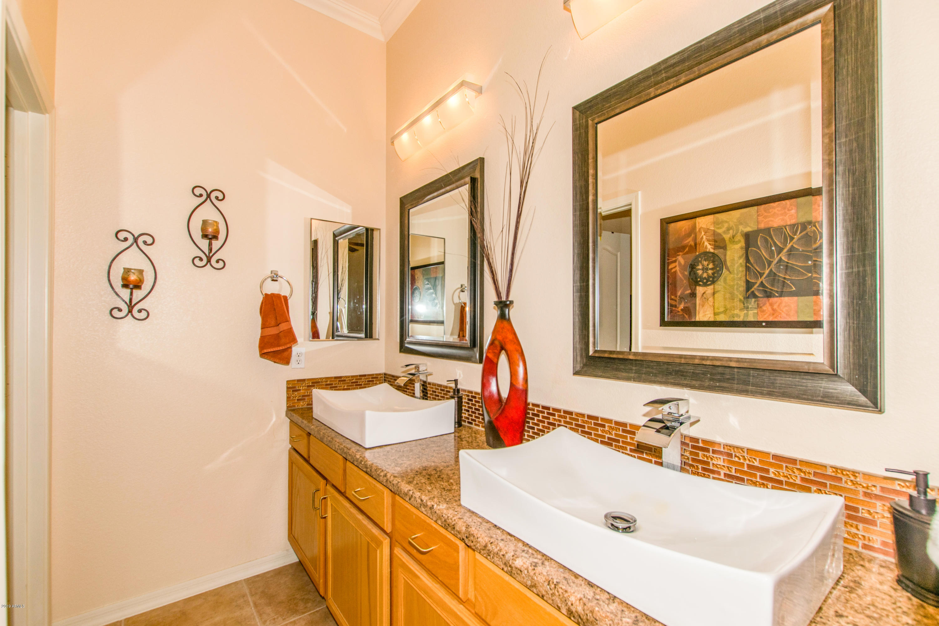 4291 South Strong Box Road Gold Canyon, AZ 85118 - Photo 16 of 27 a bathroom with a tub sink and mirror