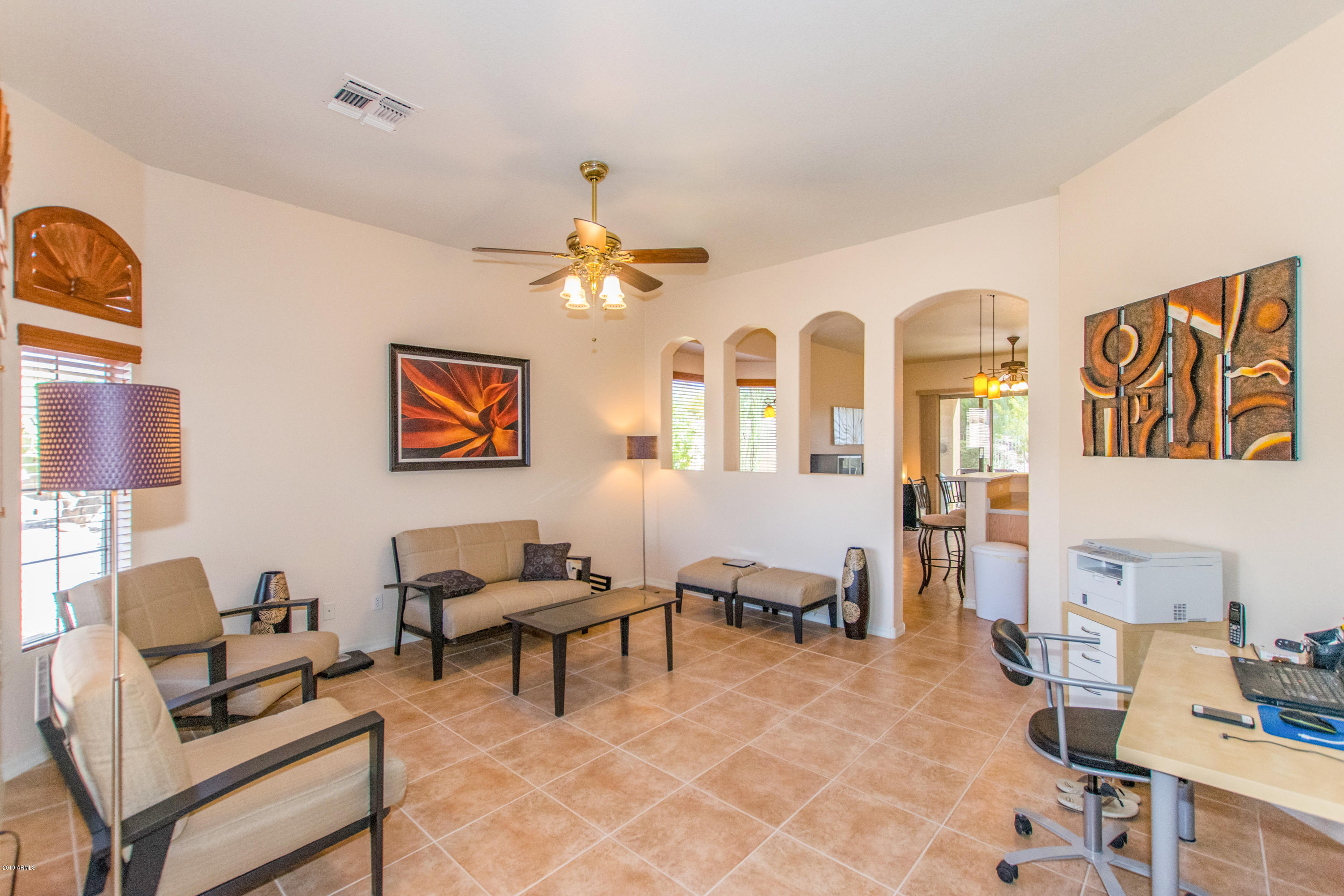 4291 South Strong Box Road Gold Canyon, AZ 85118 - Photo 2 of 27 a living room with furniture and wooden floor