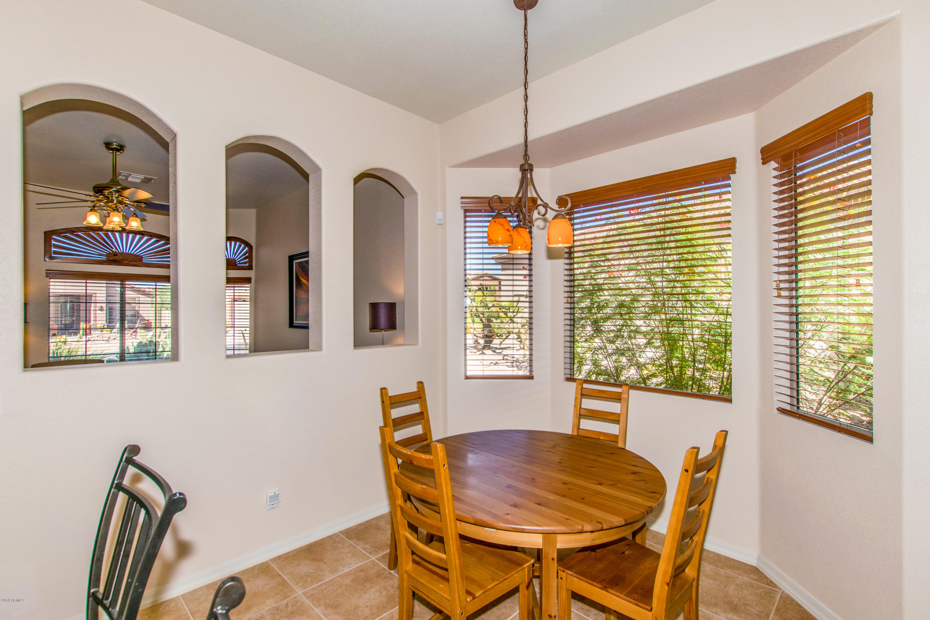 4291 South Strong Box Road Gold Canyon, AZ 85118 - Photo 7 of 27 a dining room with furniture and window