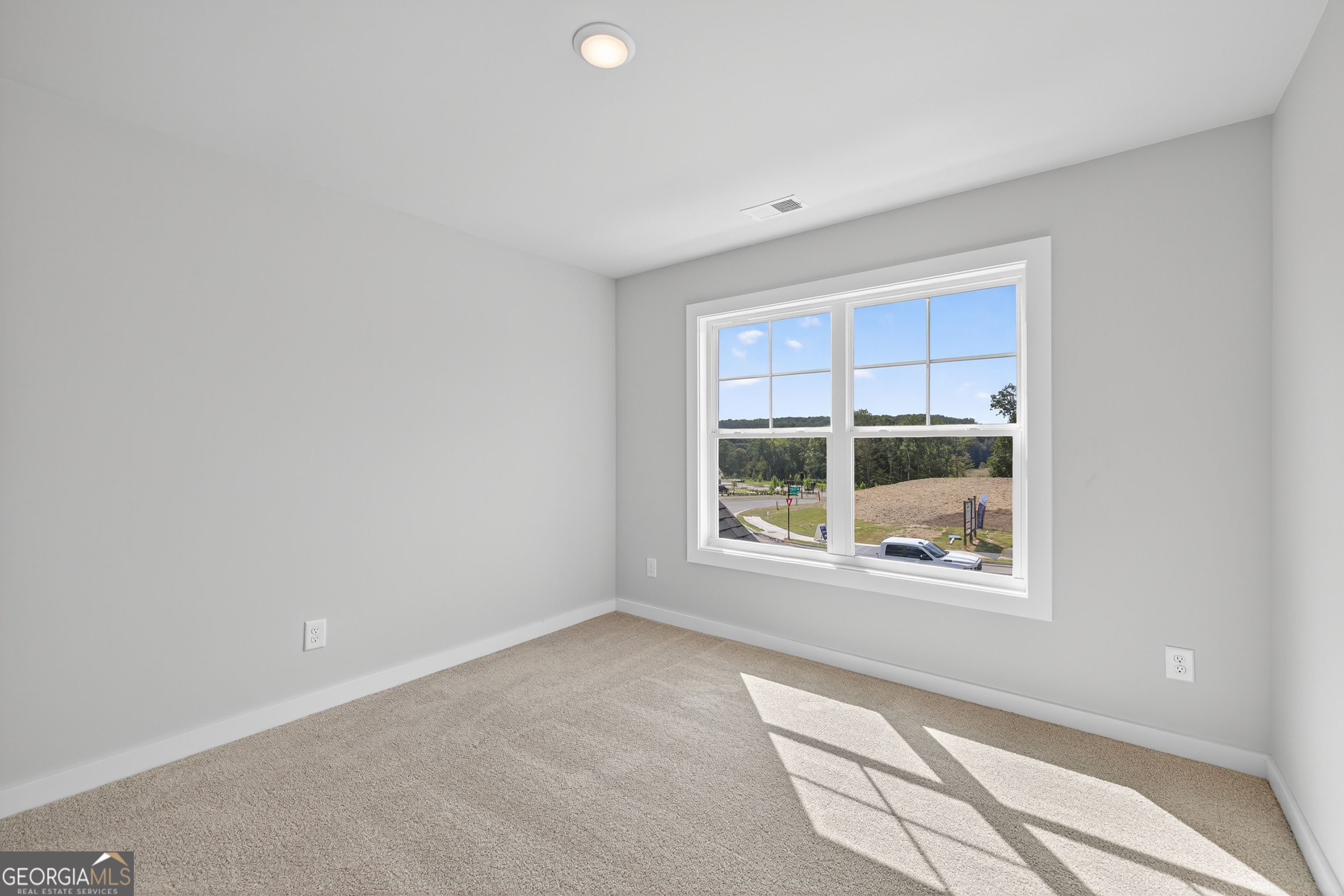 112 Patillo Manor, Unit 3 Stockbridge, GA 30281 - Photo 47 of 59 a view of an empty room with a window