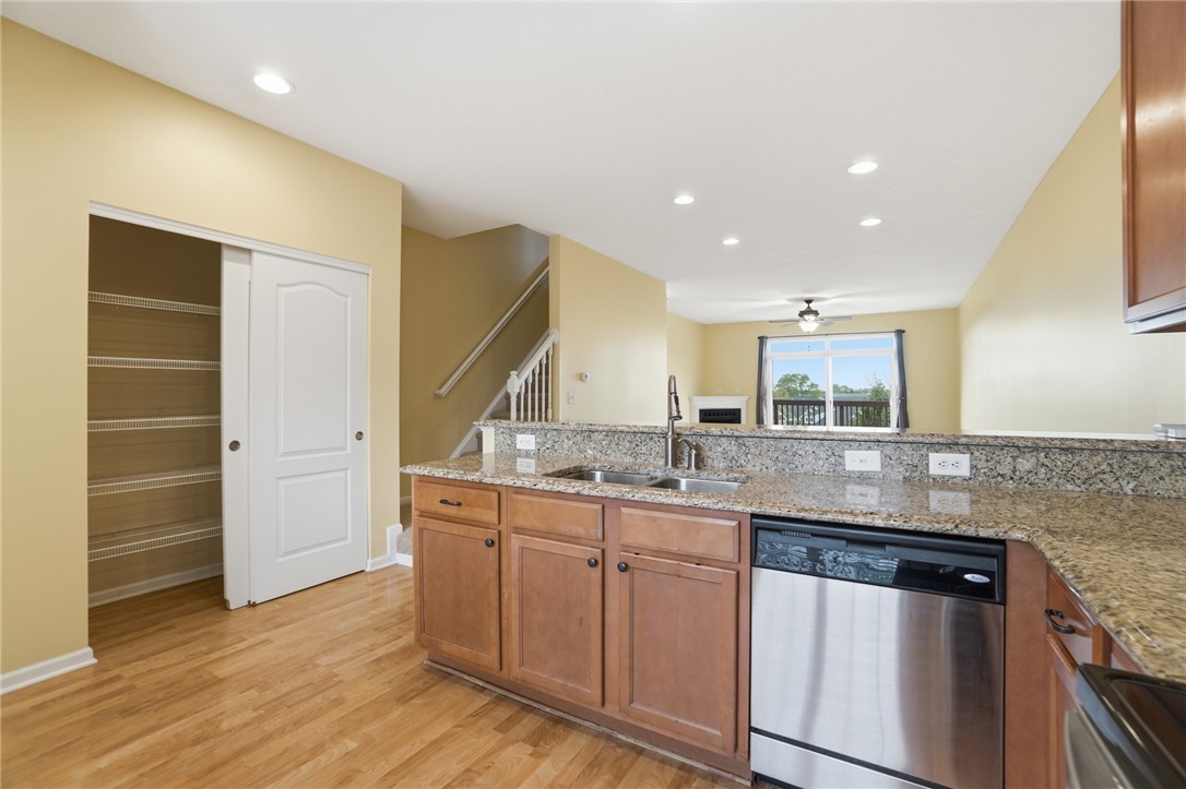 4324 Straight Arrow Road Dayton, OH 45430 - Photo 7 of 40 This bright kitchen with granite countertops seamlessly flows into a welcoming living space.