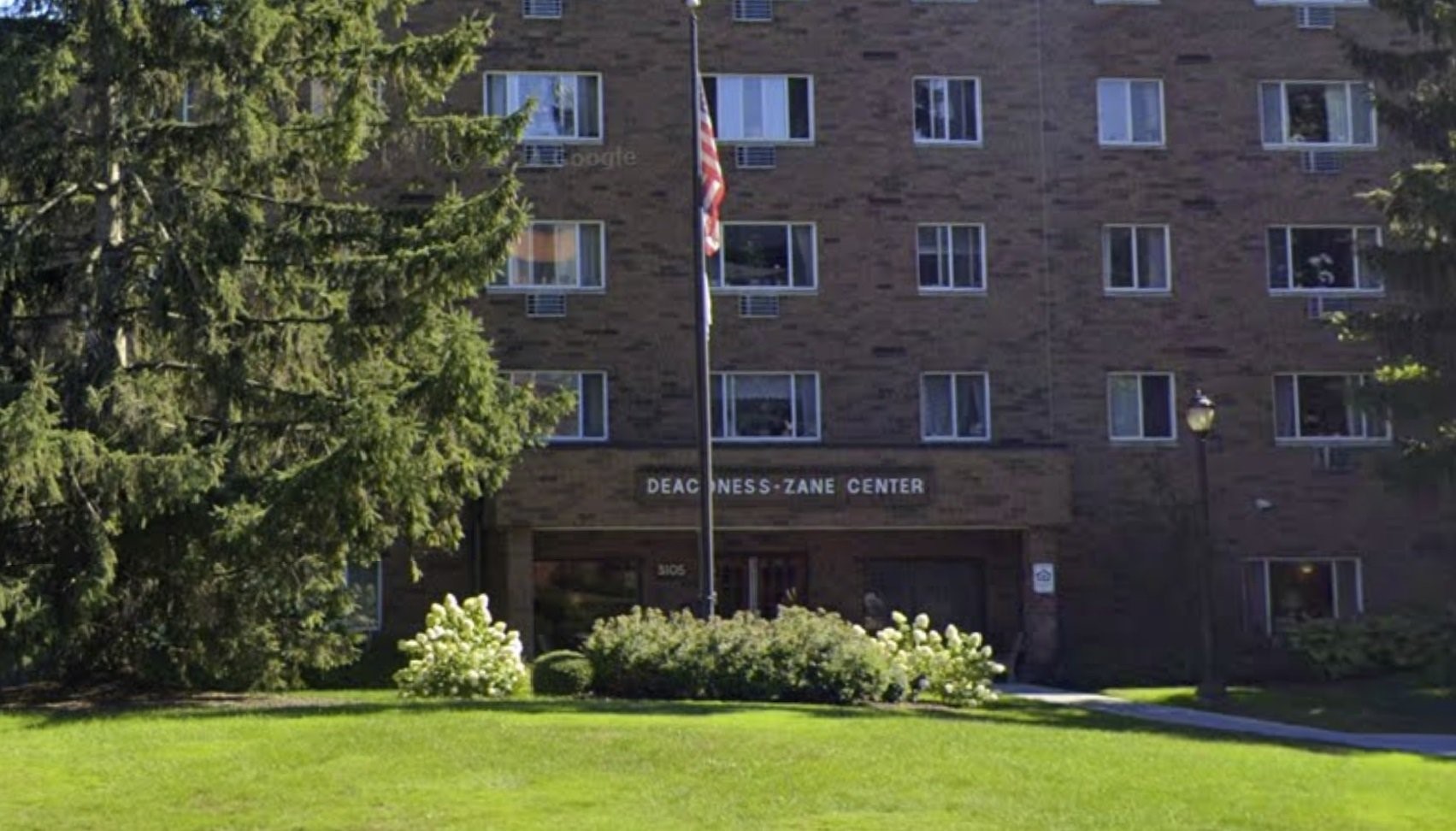 3105 Devonshire Road Cleveland, OH 44109 - Photo 5 of 8 front view of a brick house with a yard