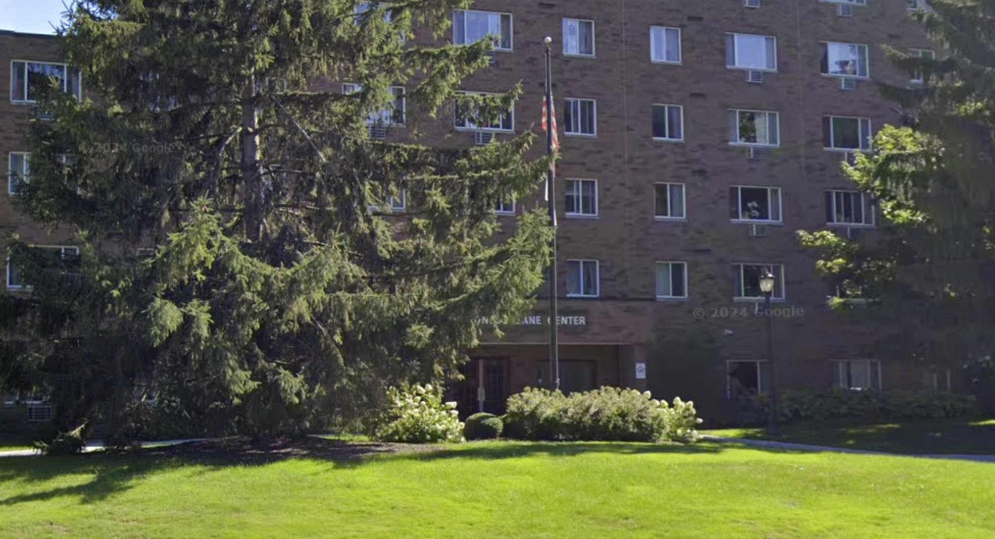 3105 Devonshire Road Cleveland, OH 44109 - Photo 6 of 8 a brick building with a yard