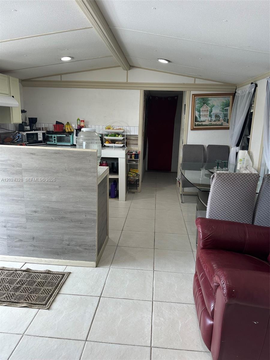 625 North Quebrada Street Clewiston, FL 33440 - Photo 4 of 26 a living room with furniture and a rug