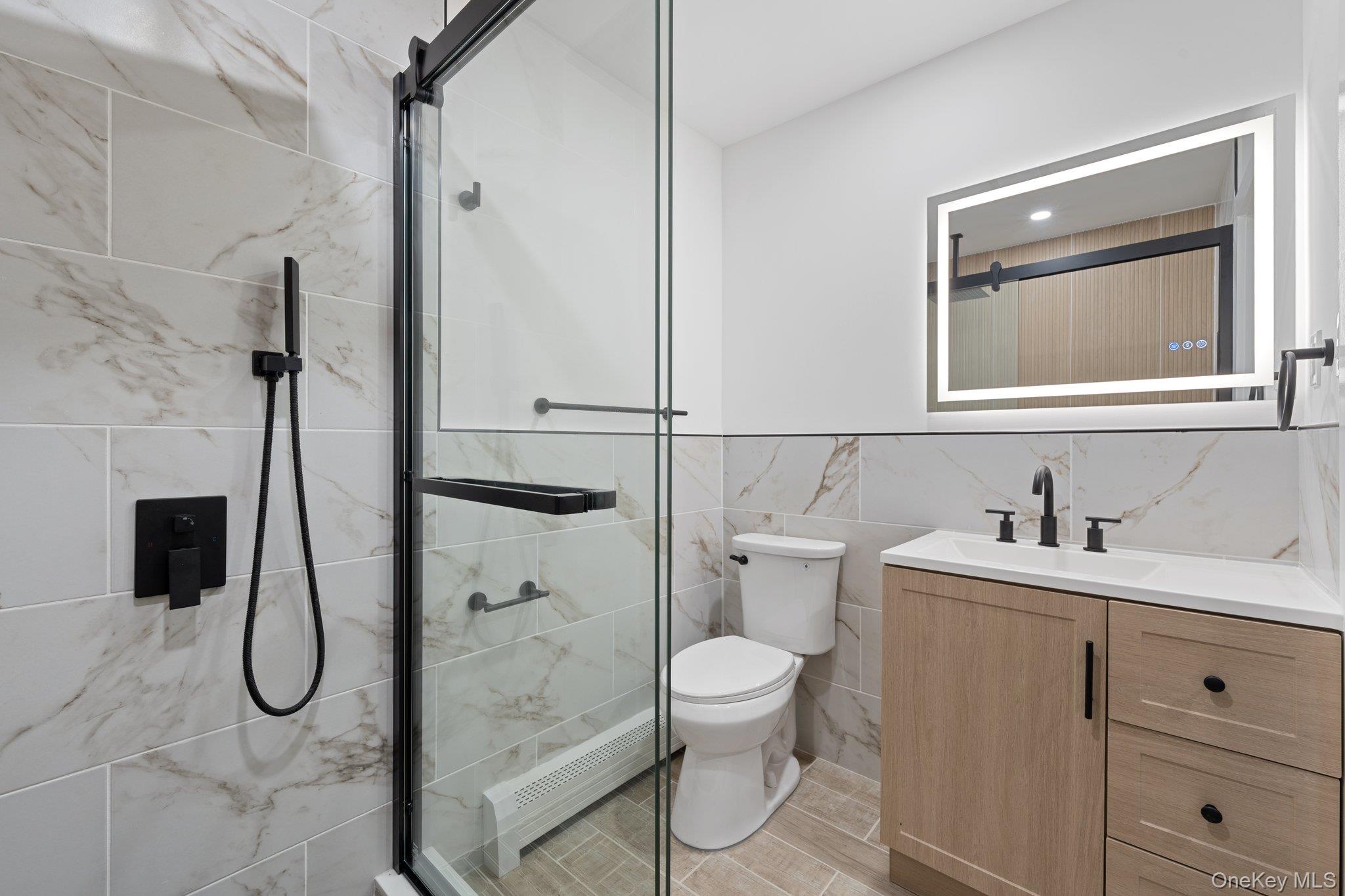 46 Mt Grey Road Stony Brook, NY 11790 - Photo 8 of 15 a bathroom with a toilet sink shower and mirror