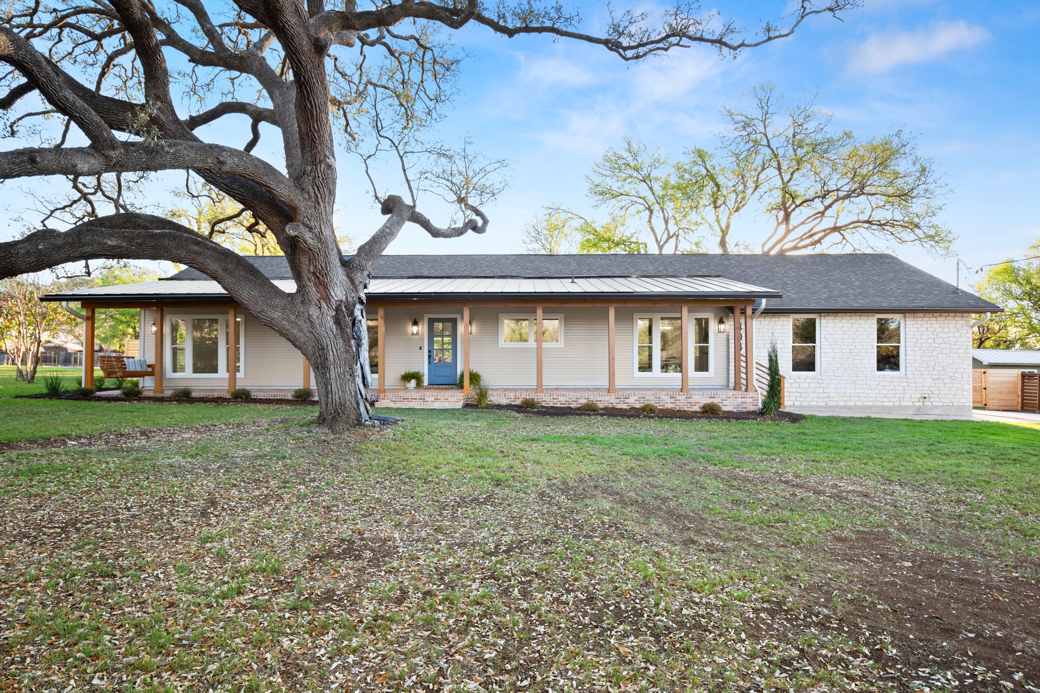 404 Bittern Drive Buda, TX 78610 - Photo 5 of 34 a view of a yard in front of a house with large trees