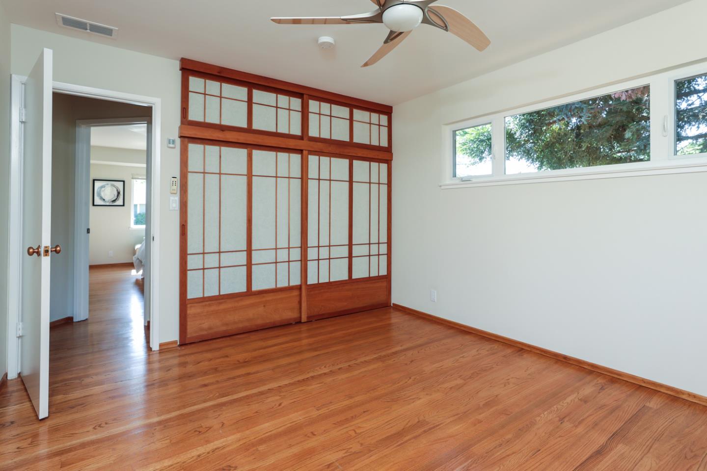 1722 Walnut Drive Mountain View, CA 94040 - Photo 16 of 35 wooden floor in an empty room with a window