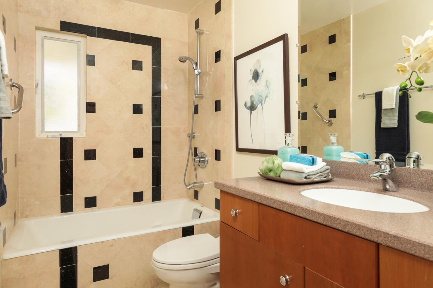 1722 Walnut Drive Mountain View, CA 94040 - Photo 17 of 35 a bathroom with a granite countertop sink toilet a mirror a shower and a bathtub