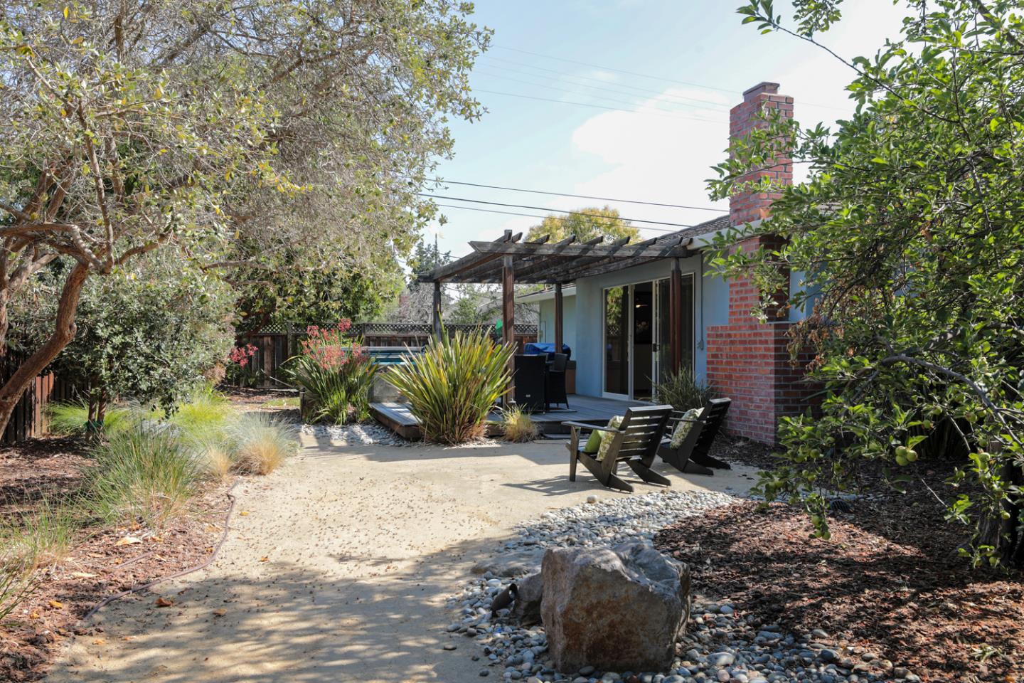 1722 Walnut Drive Mountain View, CA 94040 - Photo 23 of 35 a view of backyard with outdoor seating and plants