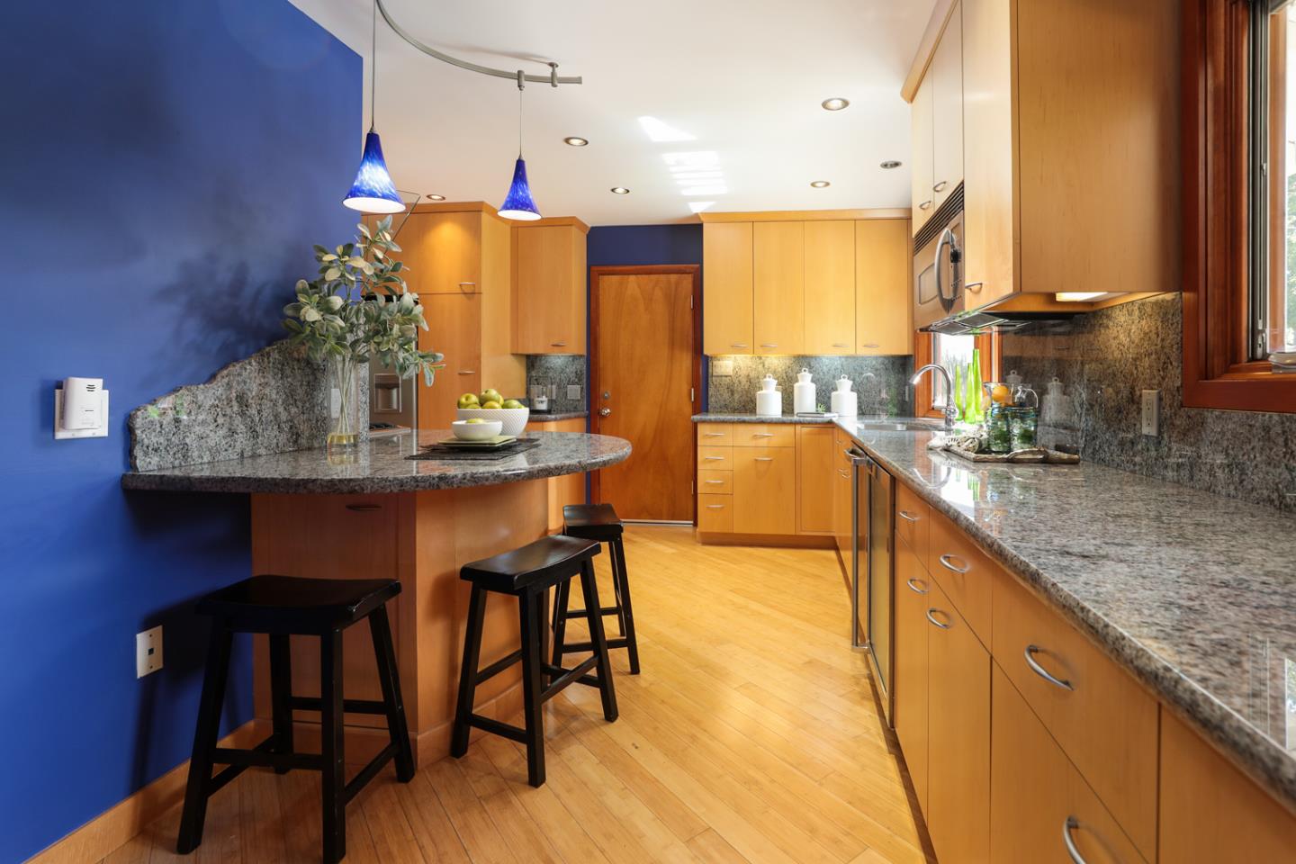 1722 Walnut Drive Mountain View, CA 94040 - Photo 9 of 35 a kitchen with stainless steel appliances granite countertop table chairs stove and sink