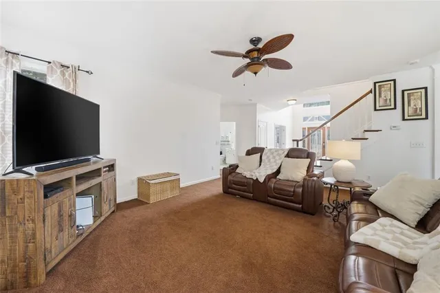 a kitchen with kitchen island a large counter top space appliances and cabinets