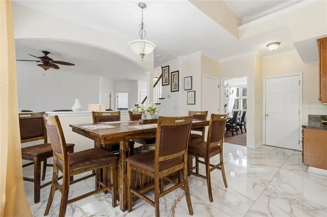 a kitchen with stainless steel appliances granite countertop a stove top oven a sink dishwasher and a refrigerator