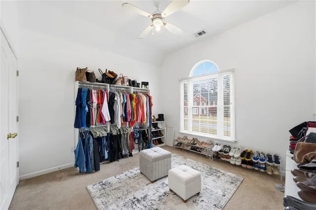 a spacious bathroom with a double vanity sink mirror and bathtub