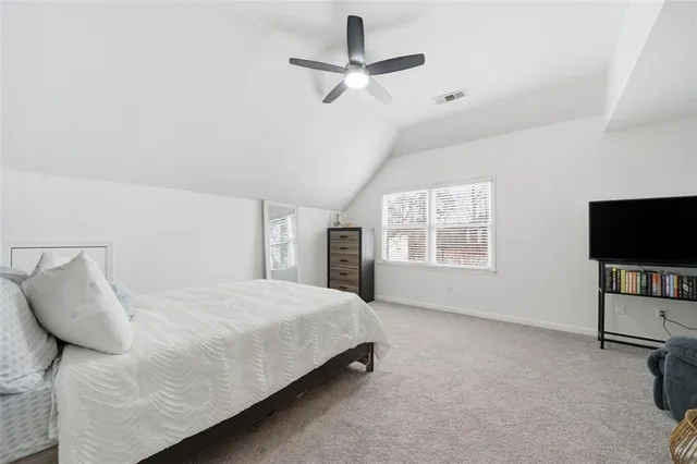 a bathroom with a tub a sink a mirror and a bathtub