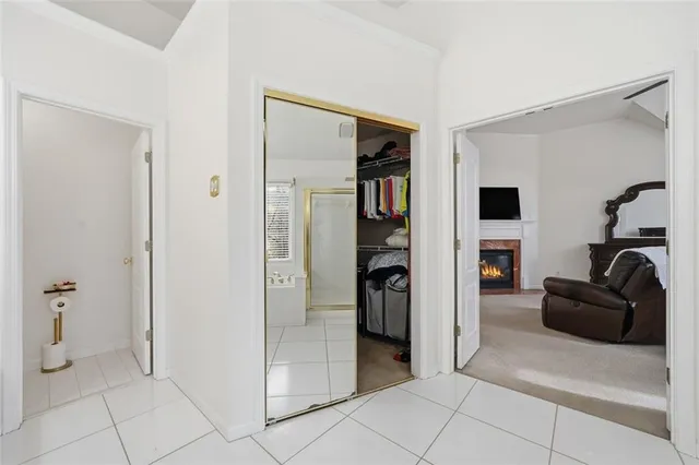 a spacious bedroom with a bed and a fireplace