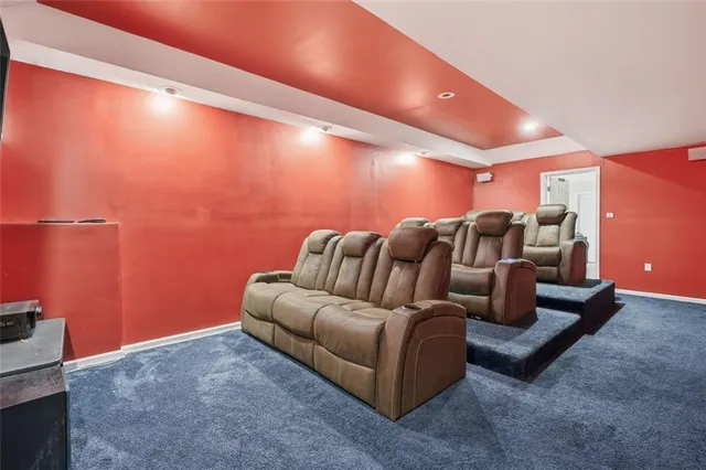 a kitchen with granite countertop a sink cabinets stainless steel appliances and a window