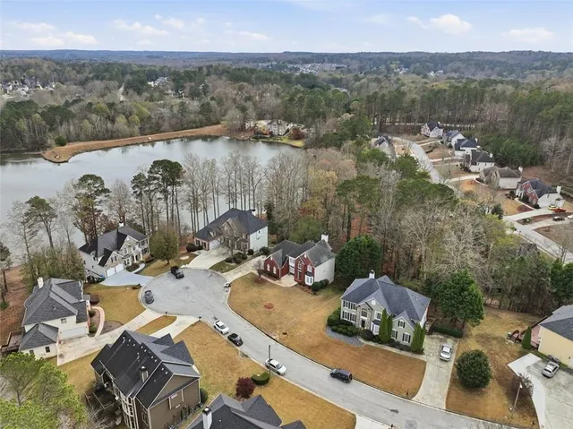 an aerial view of a house with outdoor space