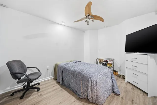 front view of a house with a wooden fence