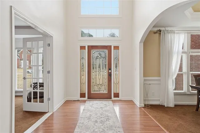a view of an entryway with wooden floor
