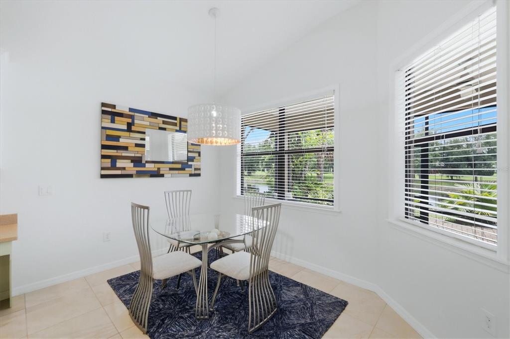 428 Snapdragon Loop Bradenton, FL 34212 - Photo 13 of 33 a dining room with furniture and window