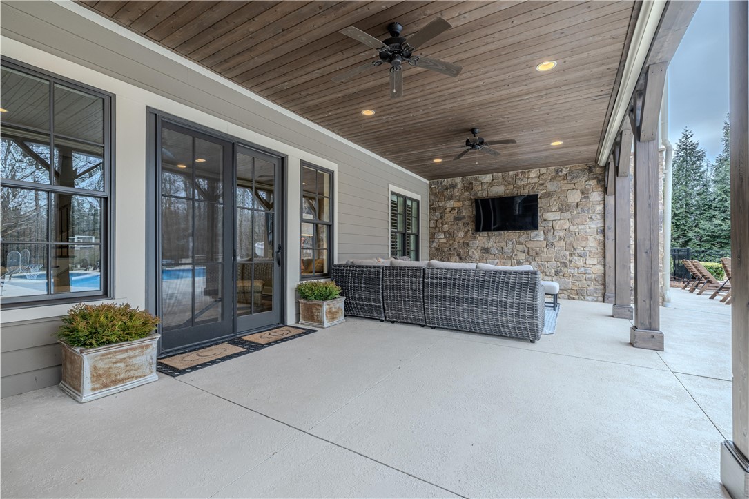 301 Stonebridge Drive Clemson, SC 29631 - Photo 42 of 47 Enjoy the inviting covered patio, ideal for relaxing outdoors and embracing the tranquility of your surroundings.